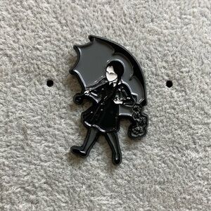 Wednesday Addams holding umbrella pin
